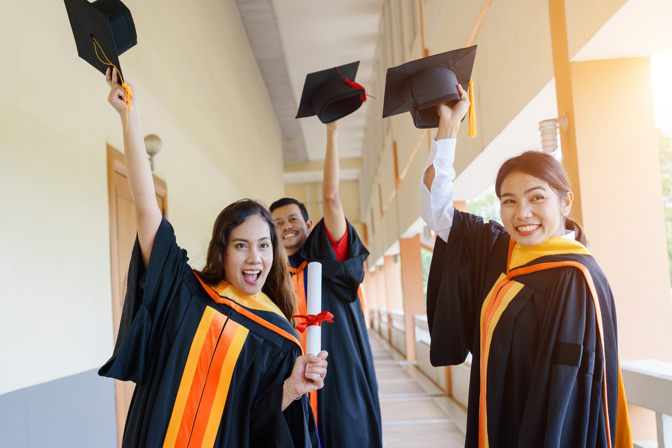 Graduates with Their Diploma